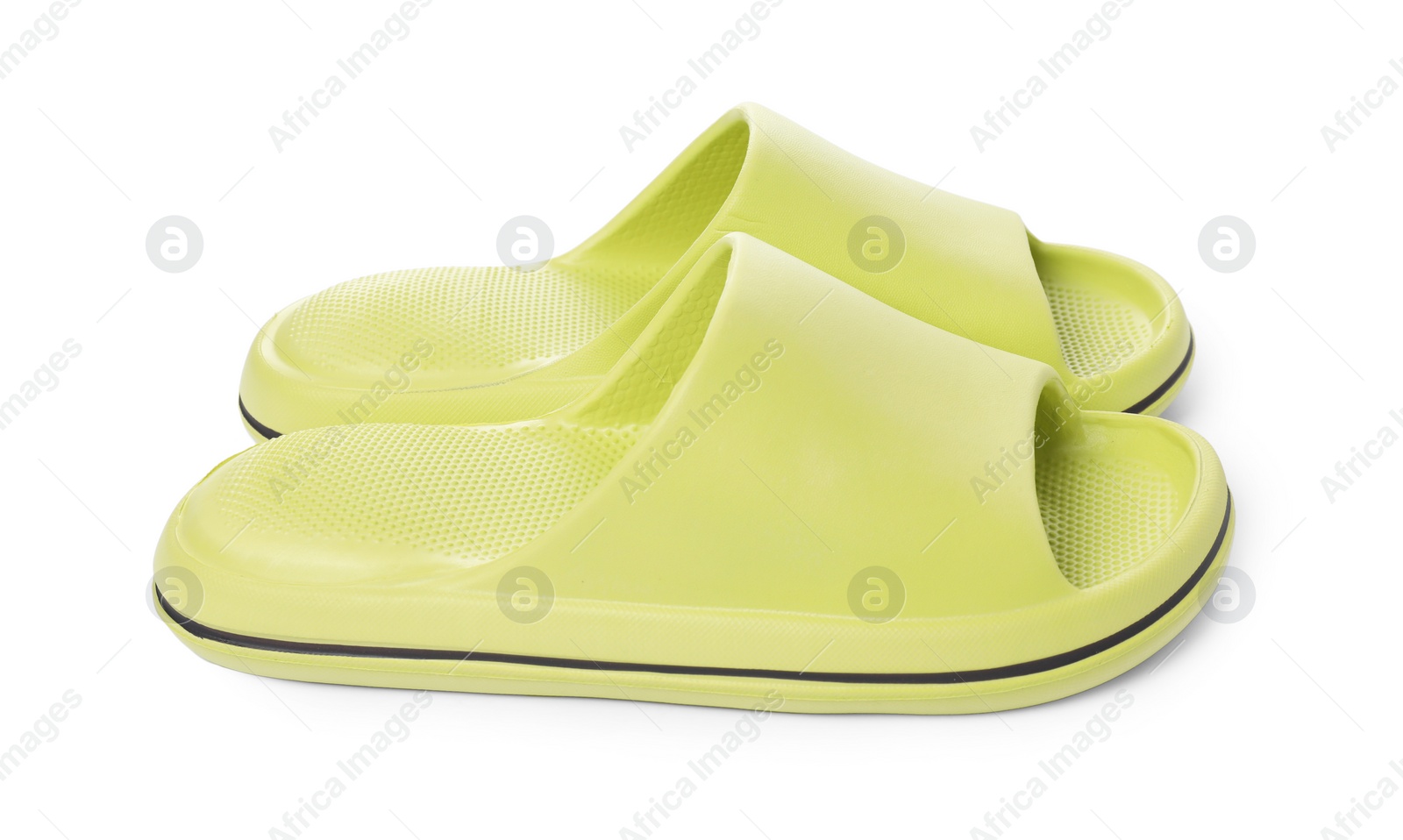 Photo of Pair of green rubber slippers isolated on white