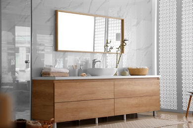 Modern bathroom interior with vessel sink and big mirror