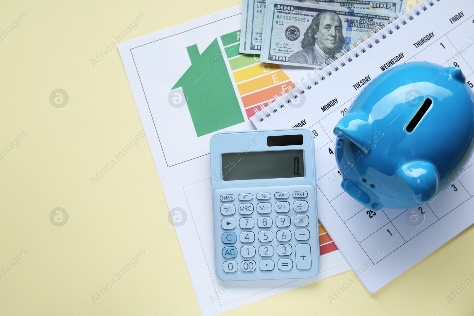 Photo of Flat lay composition with piggy bank and banknotes on beige background. Space for text