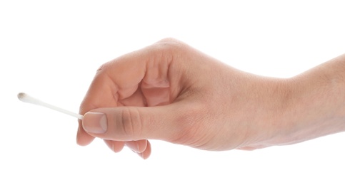 Woman holding used cotton swab on white background, closeup