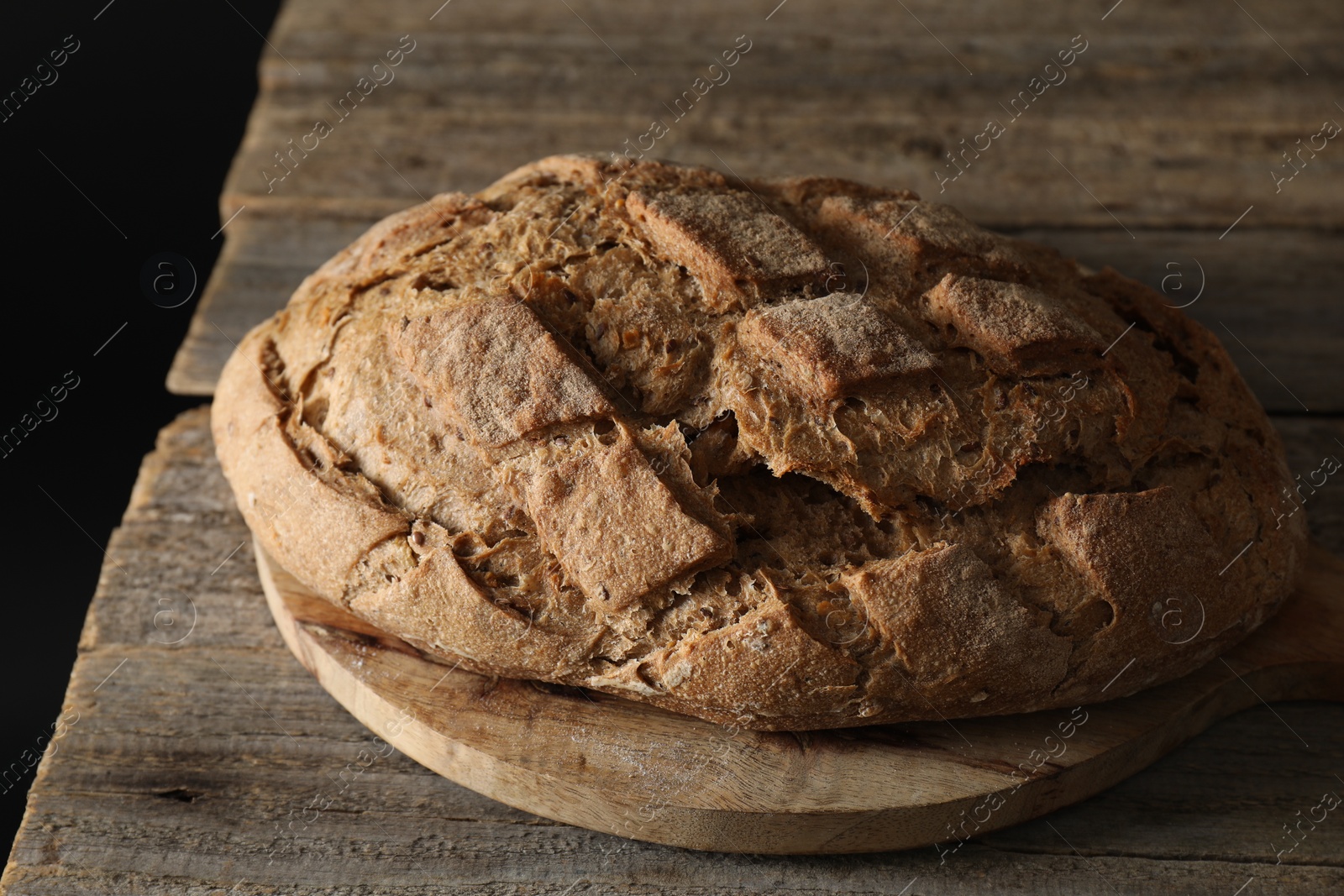 Photo of Freshly baked sourdough bread on wooden table