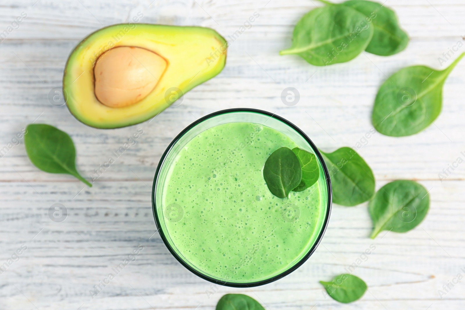 Photo of Flat lay composition with healthy detox smoothie and ingredients on light background