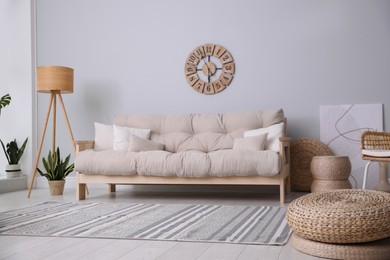 Photo of Cozy living room interior with stylish beige sofa