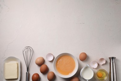 Photo of Flat lay composition with whisk and dough ingredients on light table. Space for text