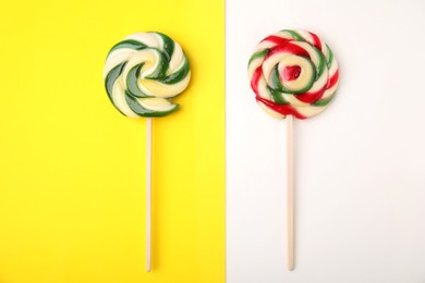 Photo of Sweet lollipops on color background, flat lay