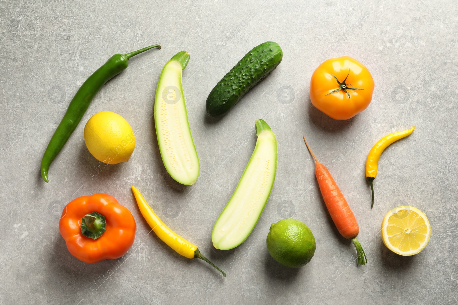 Photo of Flat lay composition with fresh vegetables and fruits on grey background