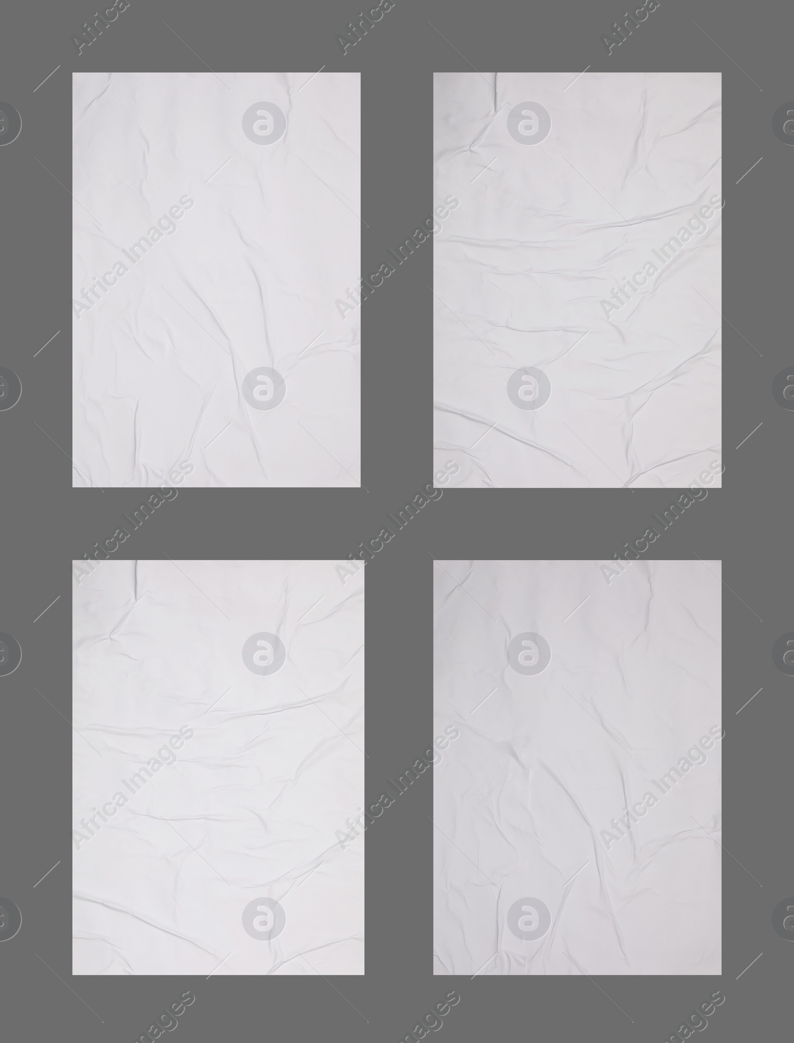 Image of Collection of creased blank posters on grey background