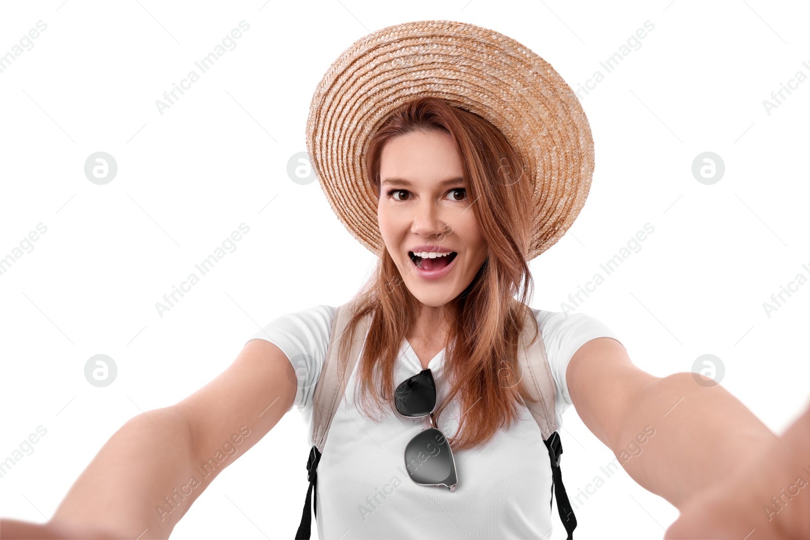 Photo of Beautiful woman in straw hat taking selfie on white background