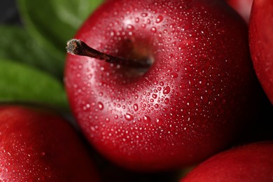 Photo of Fresh ripe red apples with water drops, closeup