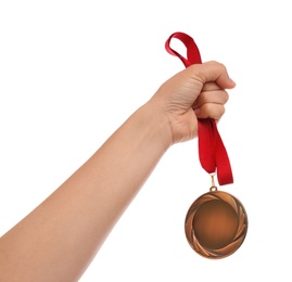 Woman holding bronze medal on white background, closeup