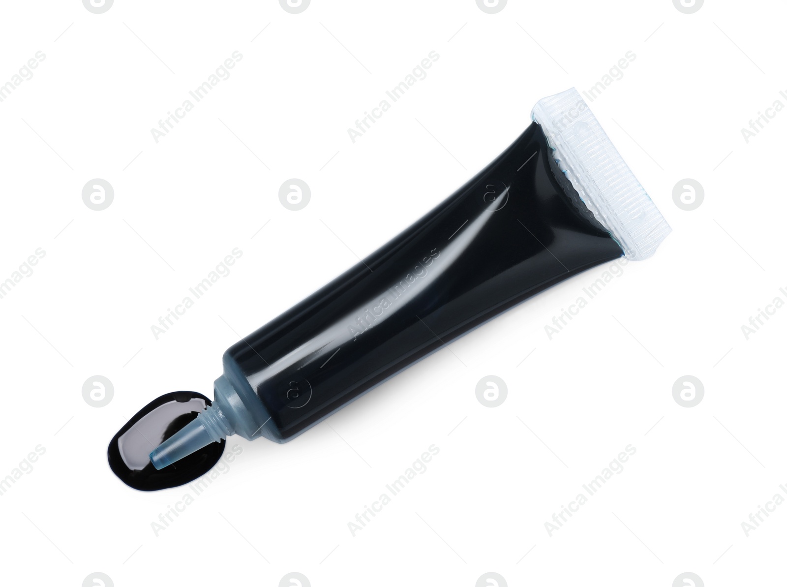 Photo of Tube with dark food coloring isolated on white, top view