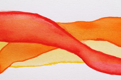 Photo of Orange watercolor lines on white background, top view