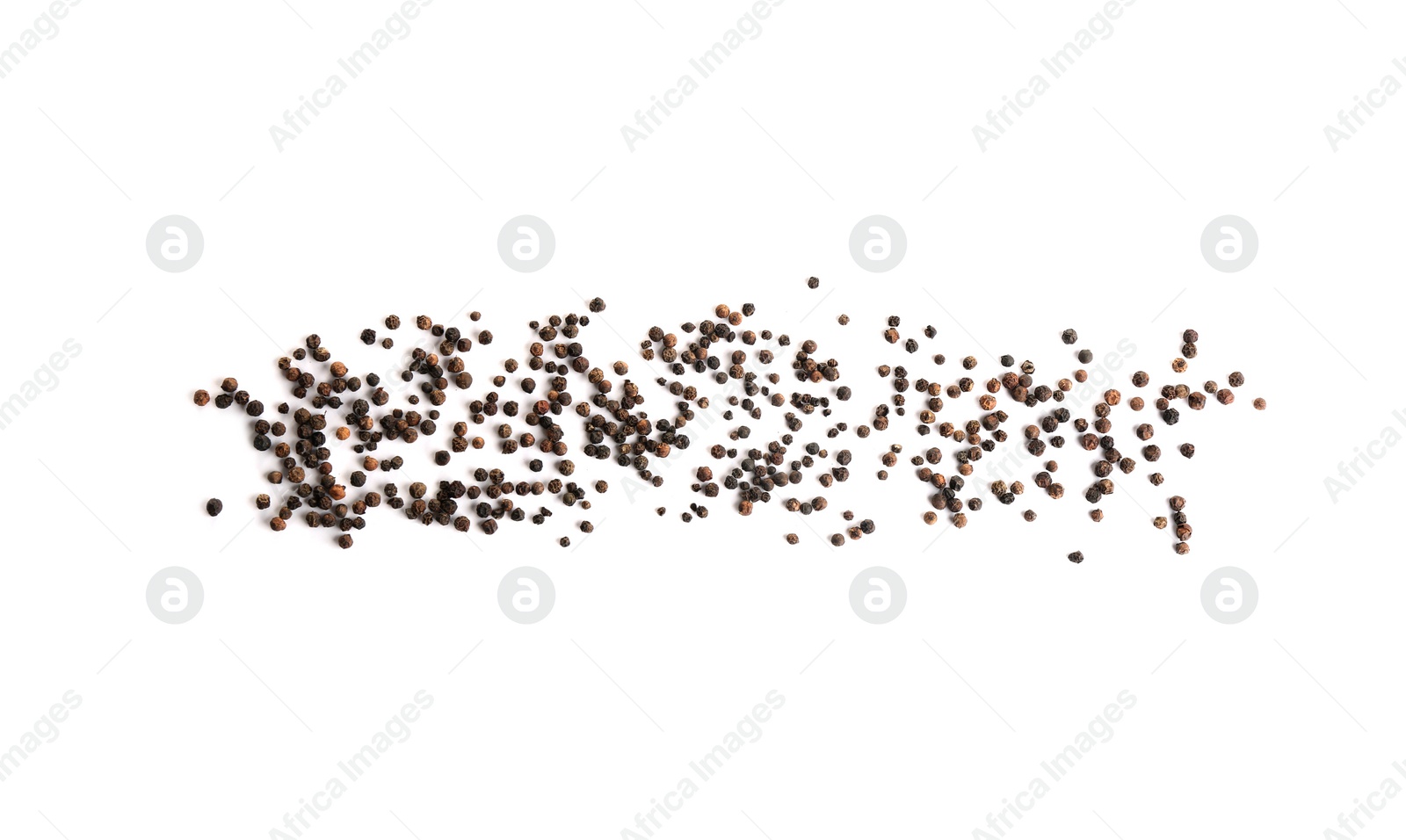 Photo of Scattered aromatic black peppercorns isolated on white