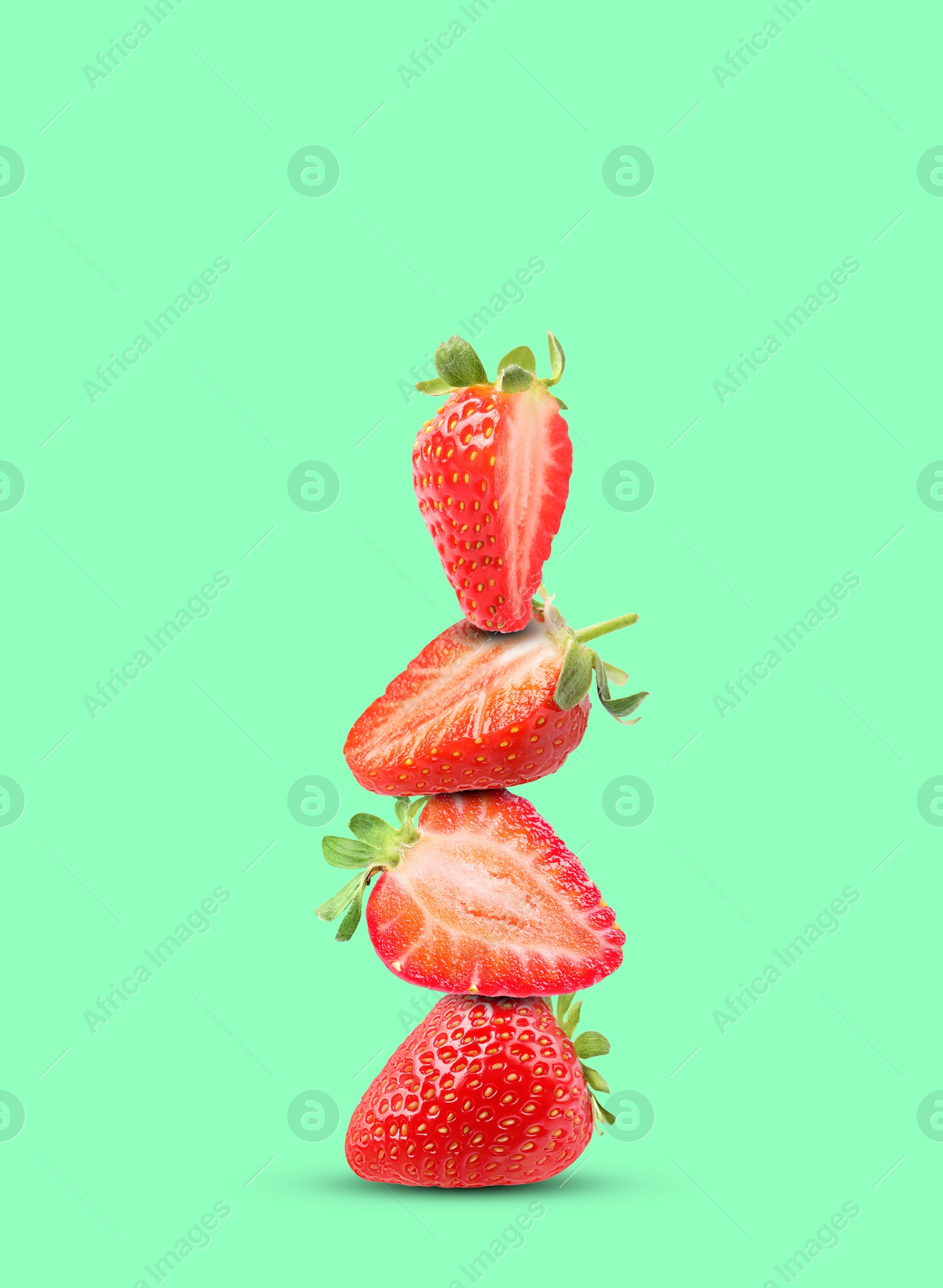 Image of Stack of fresh strawberries on aquamarine background