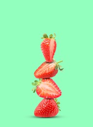 Image of Stack of fresh strawberries on aquamarine background