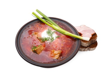 Photo of Tasty borscht, green onion and bread with ham isolated on white