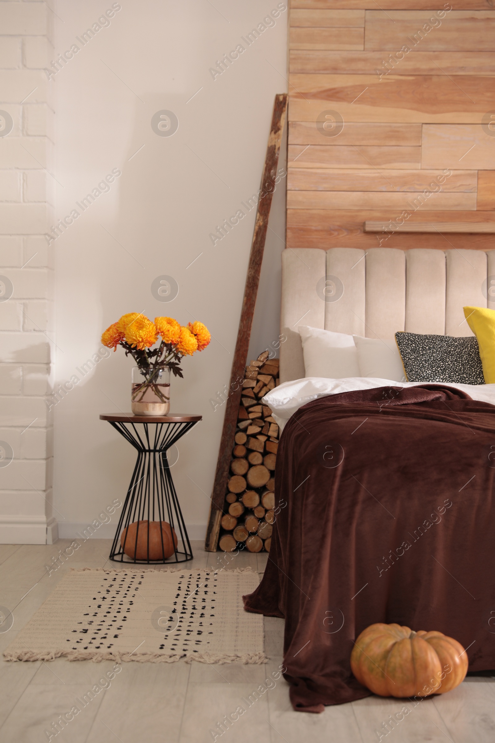 Photo of Cozy bedroom interior inspired by autumn color scheme