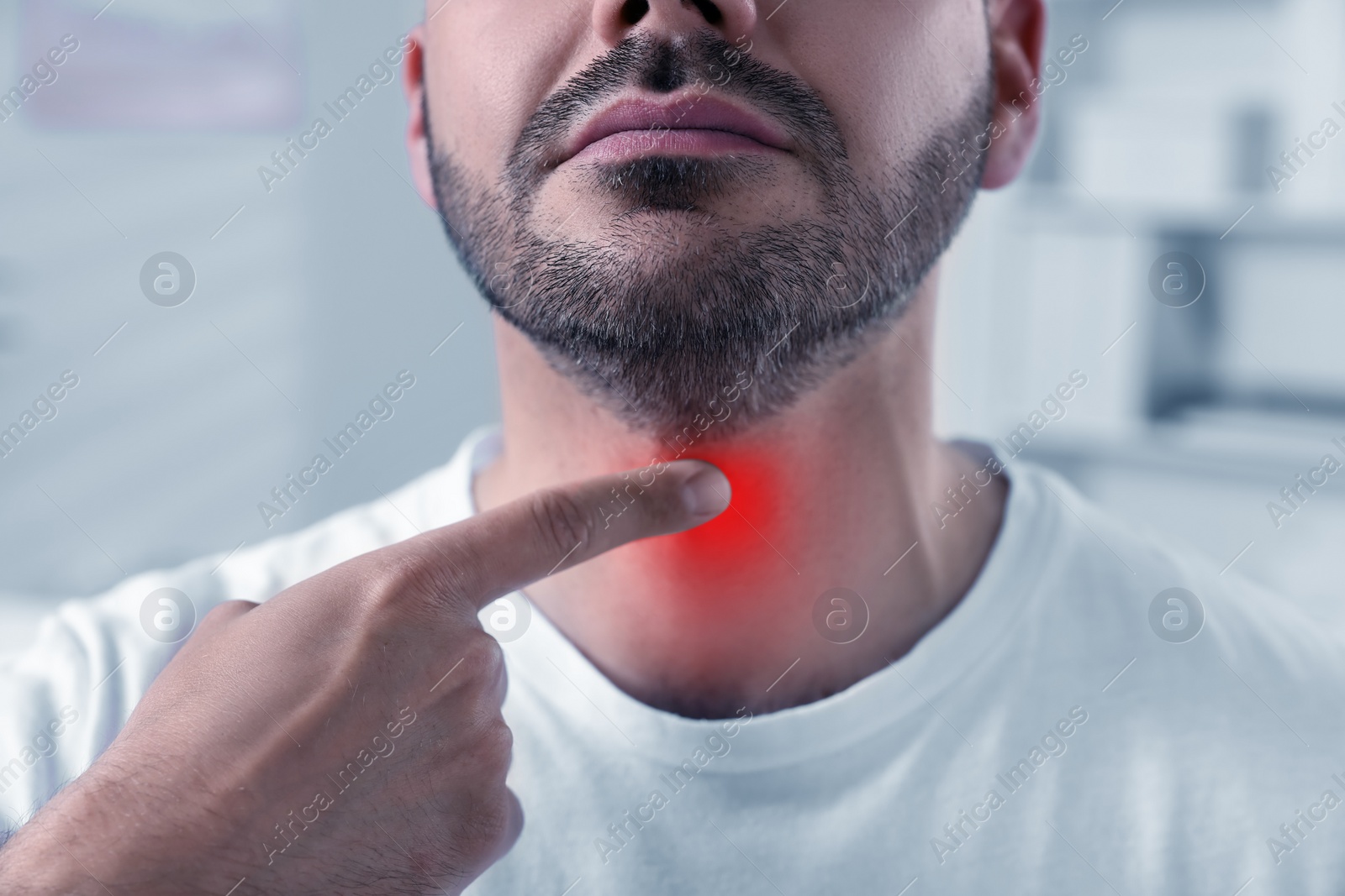 Image of Endocrine system. Man doing thyroid self examination indoors, closeup