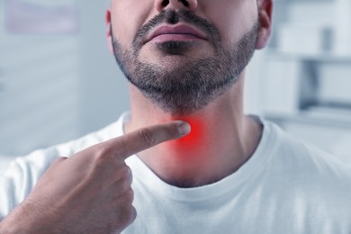 Image of Endocrine system. Man doing thyroid self examination indoors, closeup