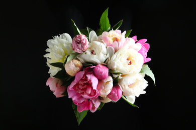 Photo of Bouquet of beautiful peonies on black background