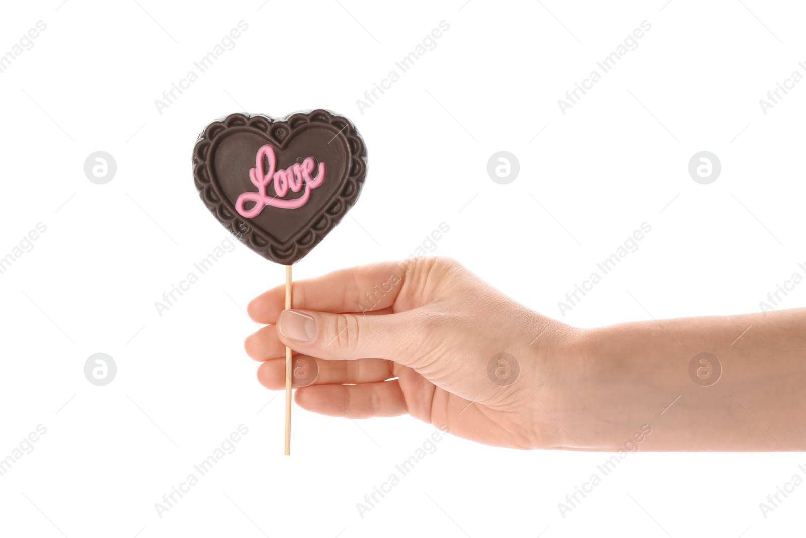 Photo of Woman holding heart shaped lollipops made of chocolate on white background, closeup