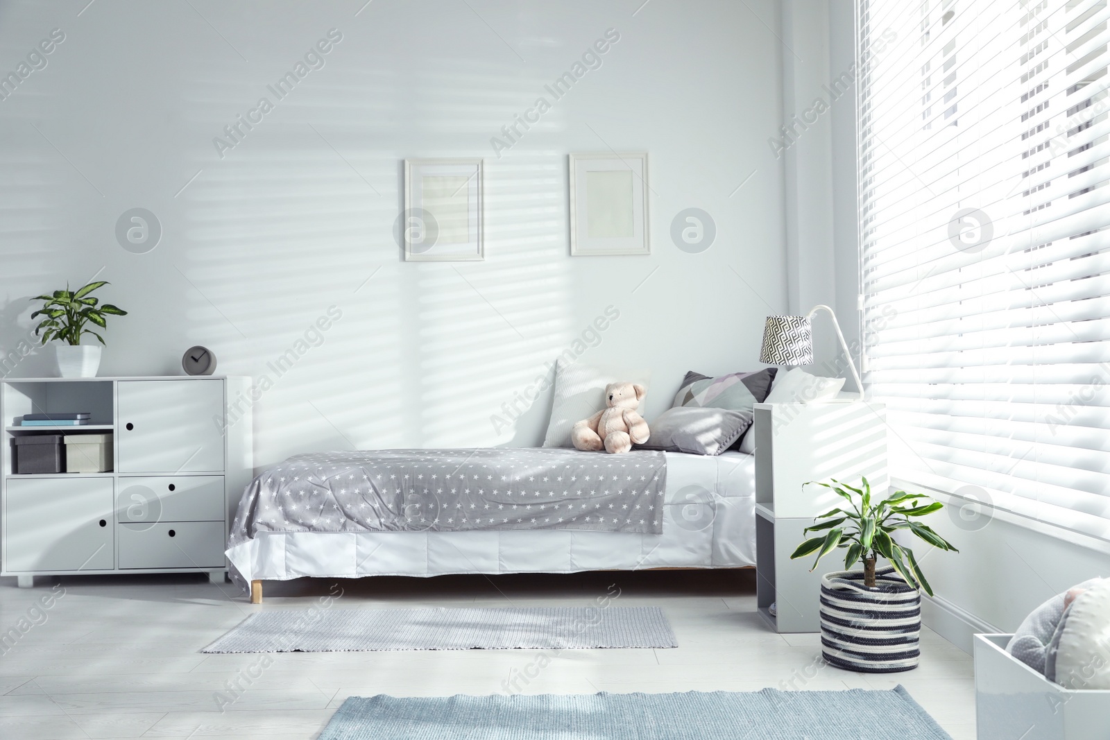 Photo of Modern child room interior with comfortable bed