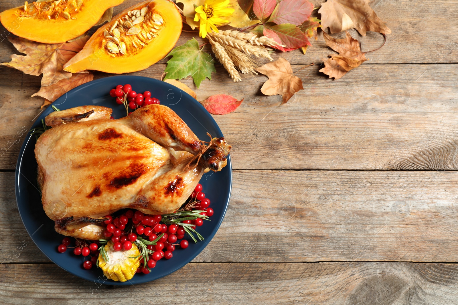 Photo of Flat lay composition with delicious turkey on wooden background, space for text. Happy Thanksgiving day