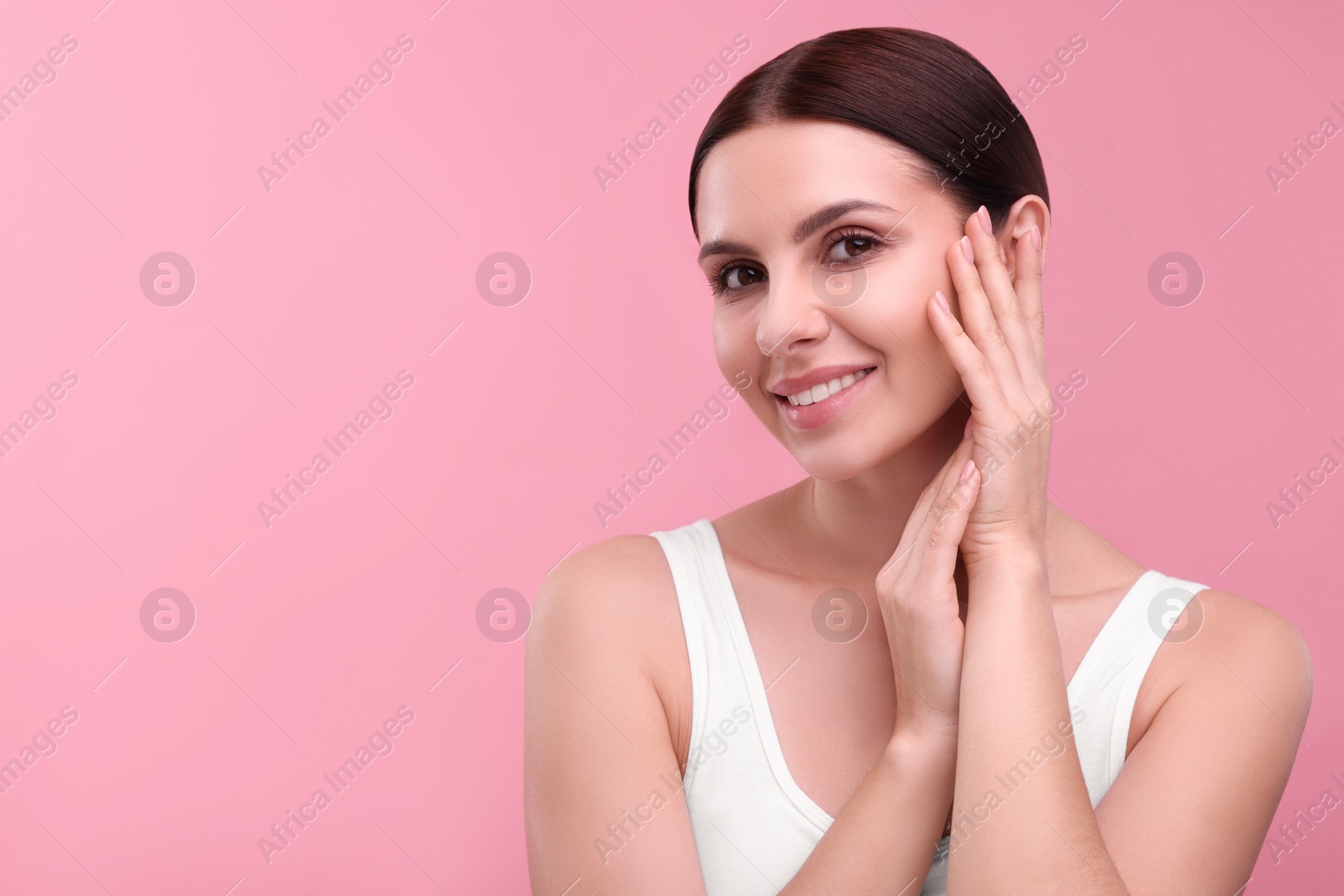 Photo of Beautiful woman with healthy skin on pink background, space for text. Body Care