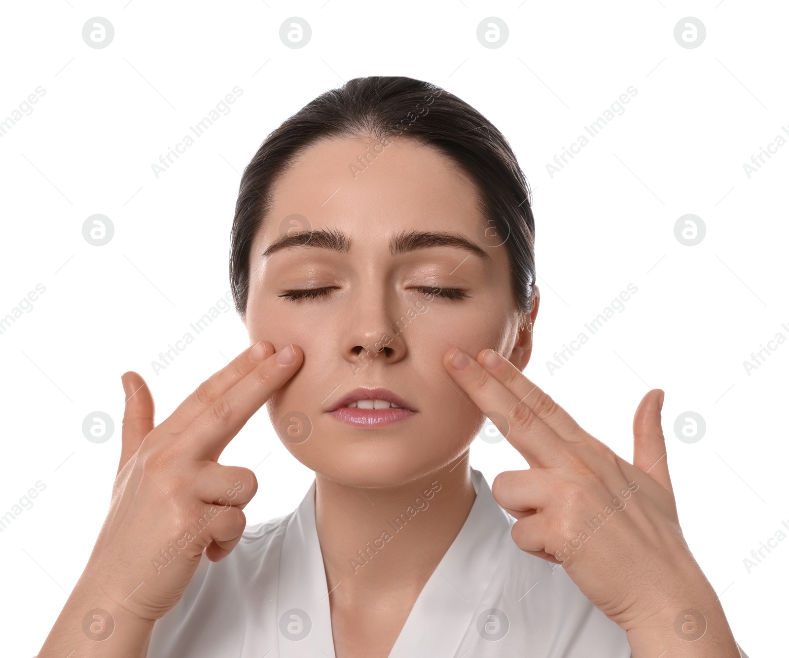 Photo of Young woman massaging her face on white background