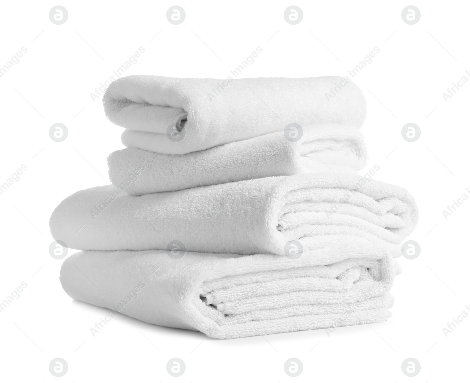 Photo of Stack of clean soft towels on white background