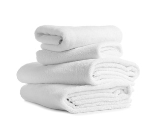 Stack of clean soft towels on white background