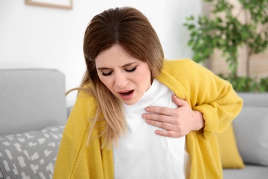 Woman having heart attack at home