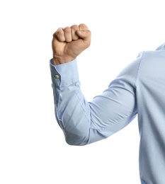 Photo of Young man showing clenched fist on white background