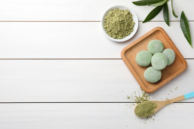 Photo of Delicious matcha mochi on white wooden table, flat lay. Space for text