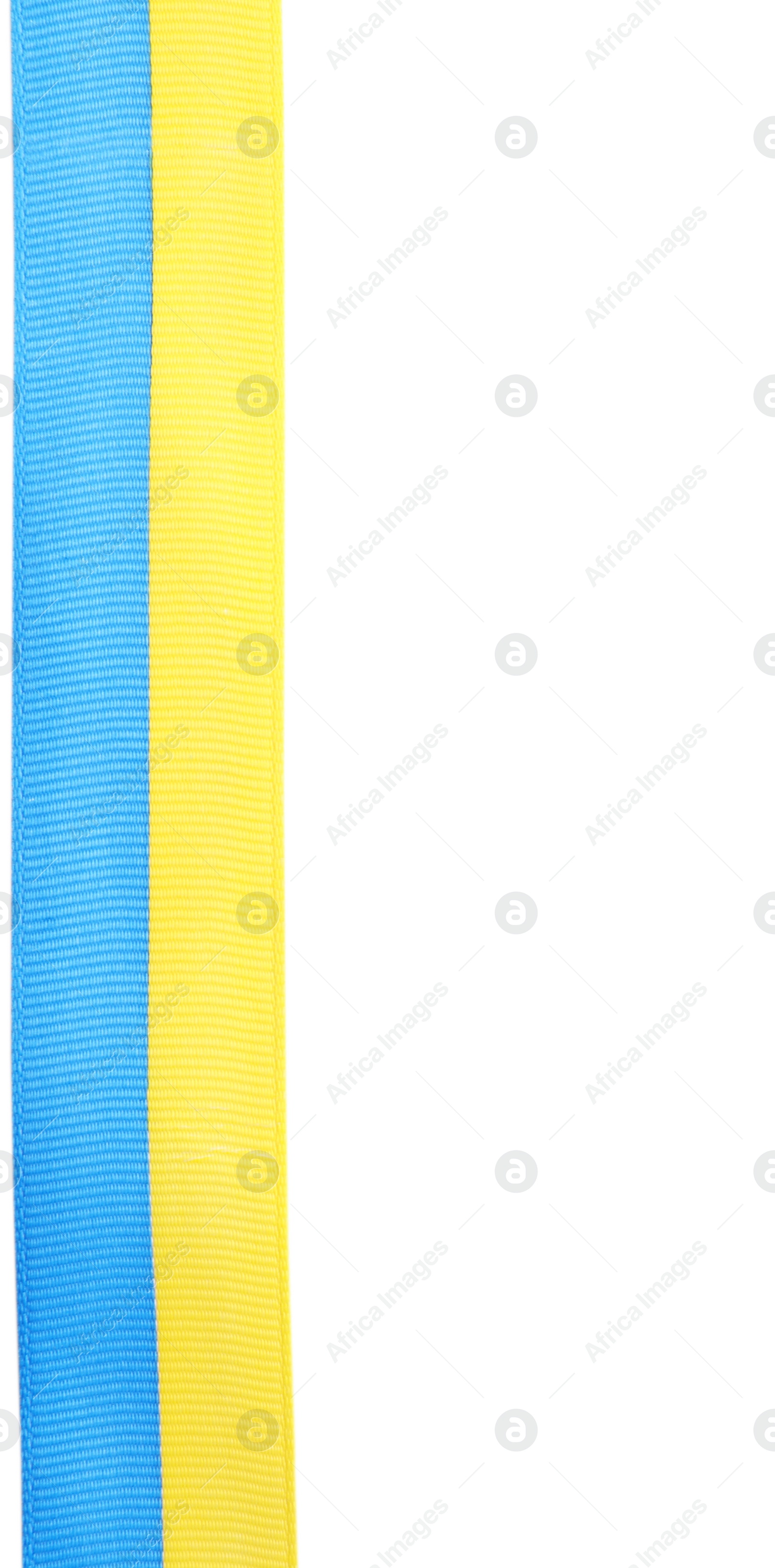 Photo of Ribbon with colors of national Ukrainian flag isolated on white, top view