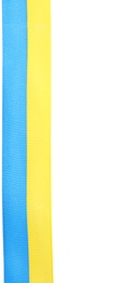 Photo of Ribbon with colors of national Ukrainian flag isolated on white, top view