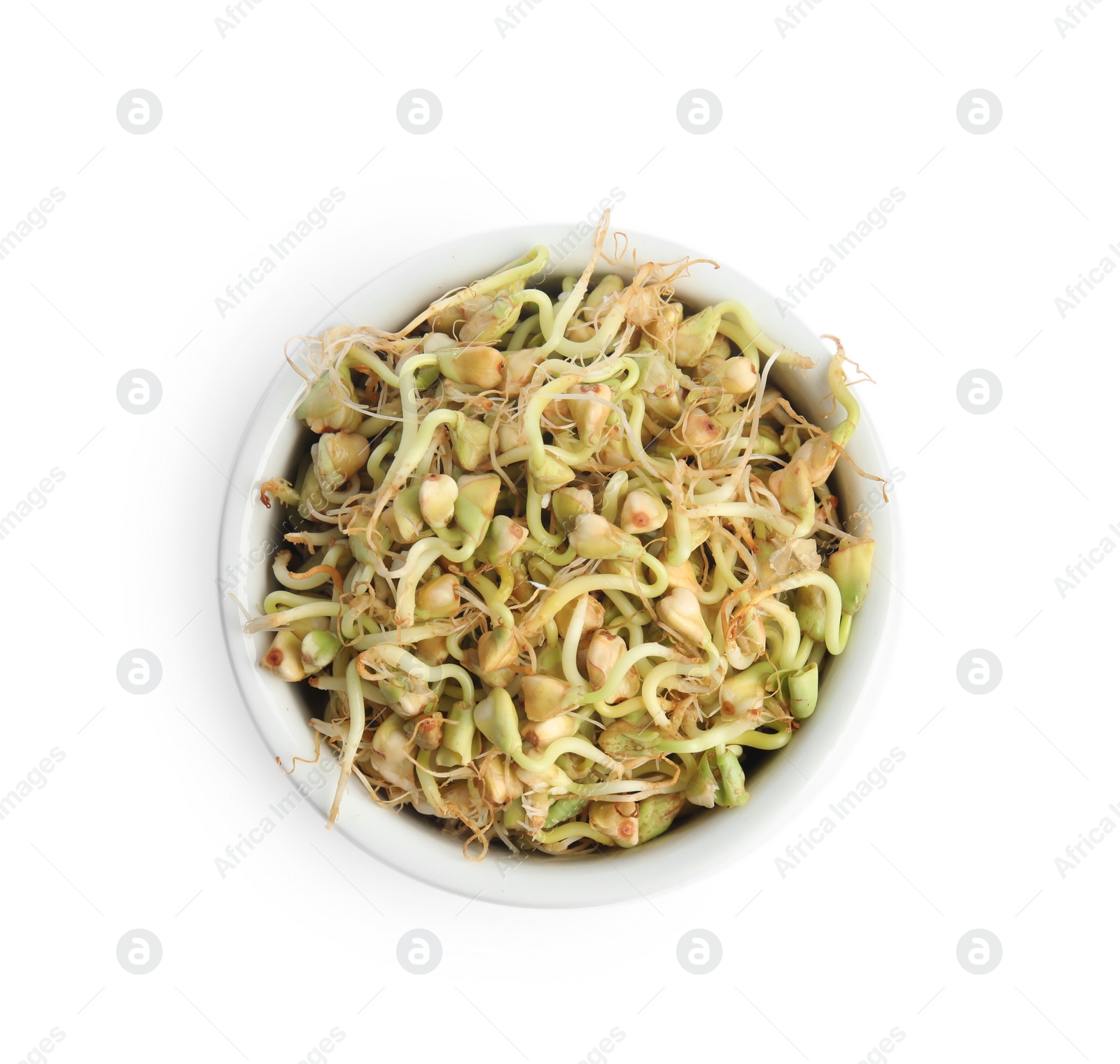 Photo of Bowl of sprouted green buckwheat isolated on white, top view