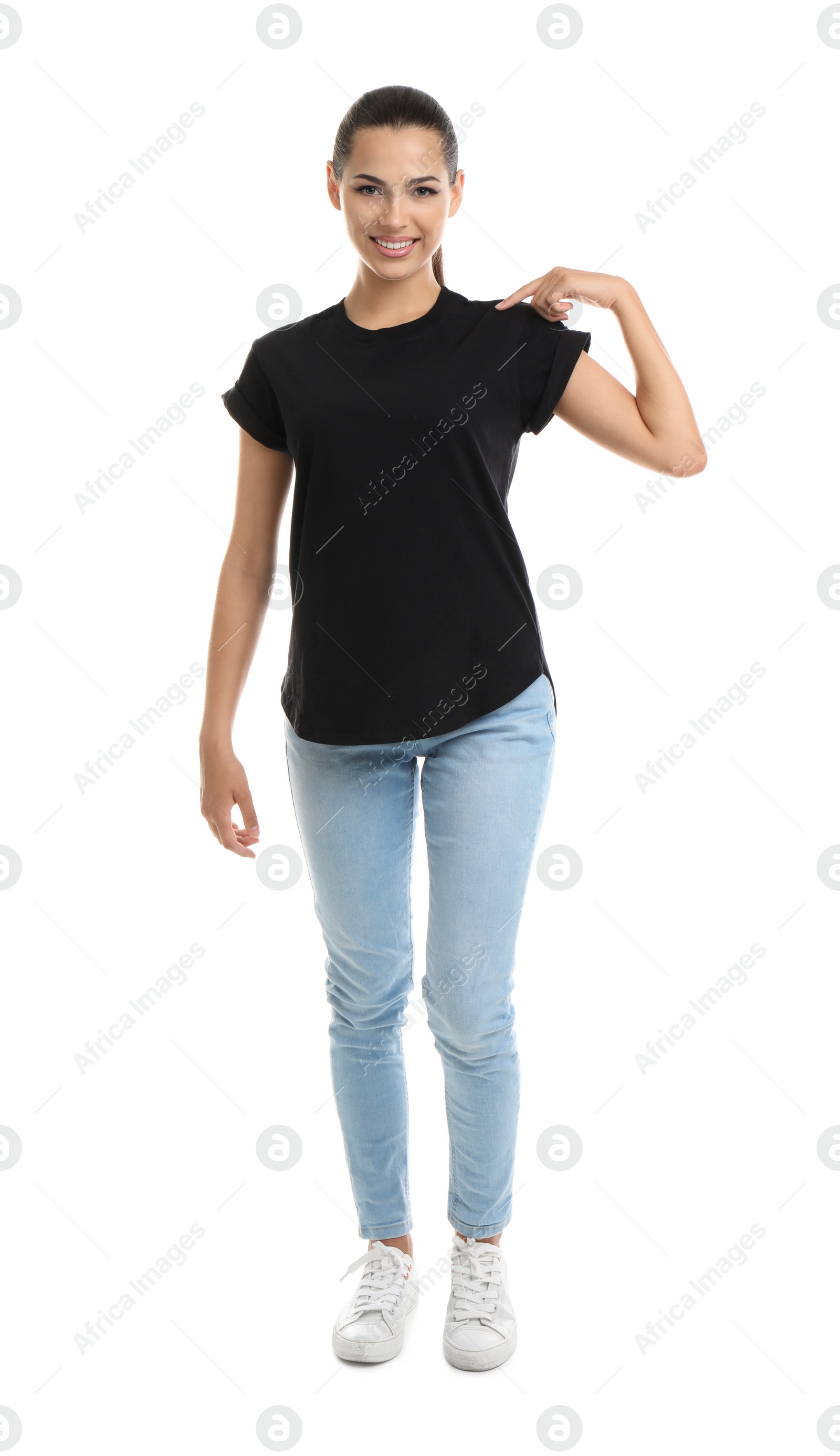 Photo of Young woman in t-shirt on white background. Mockup for design