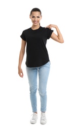 Photo of Young woman in t-shirt on white background. Mockup for design