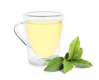 Image of Green tea in glass cup and green leaves isolated on white