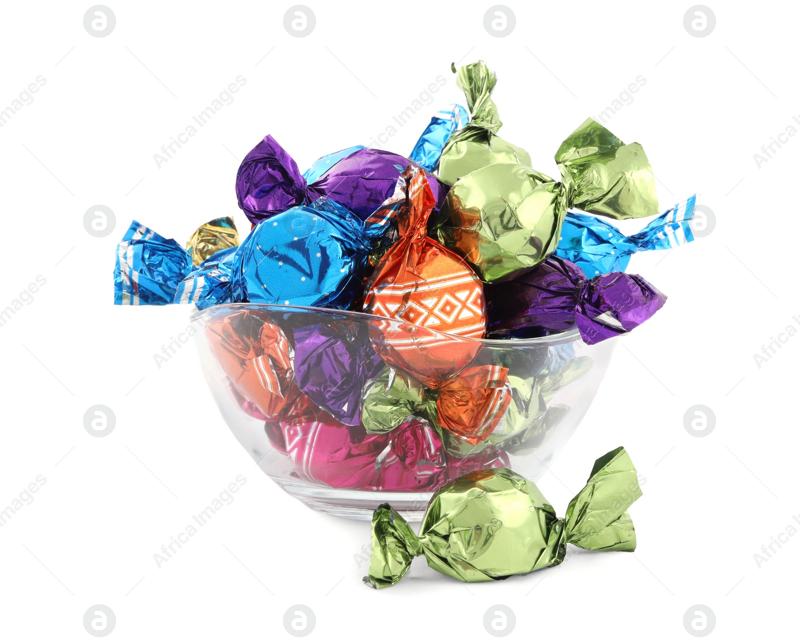 Photo of Bowl with sweet candies in colorful wrappers on white background