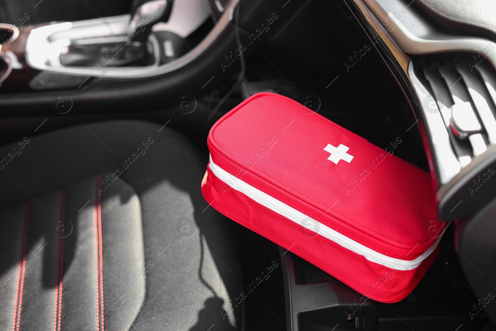 Photo of First aid kit with medicaments inside car