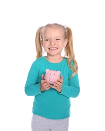 Little girl with piggy bank on white background