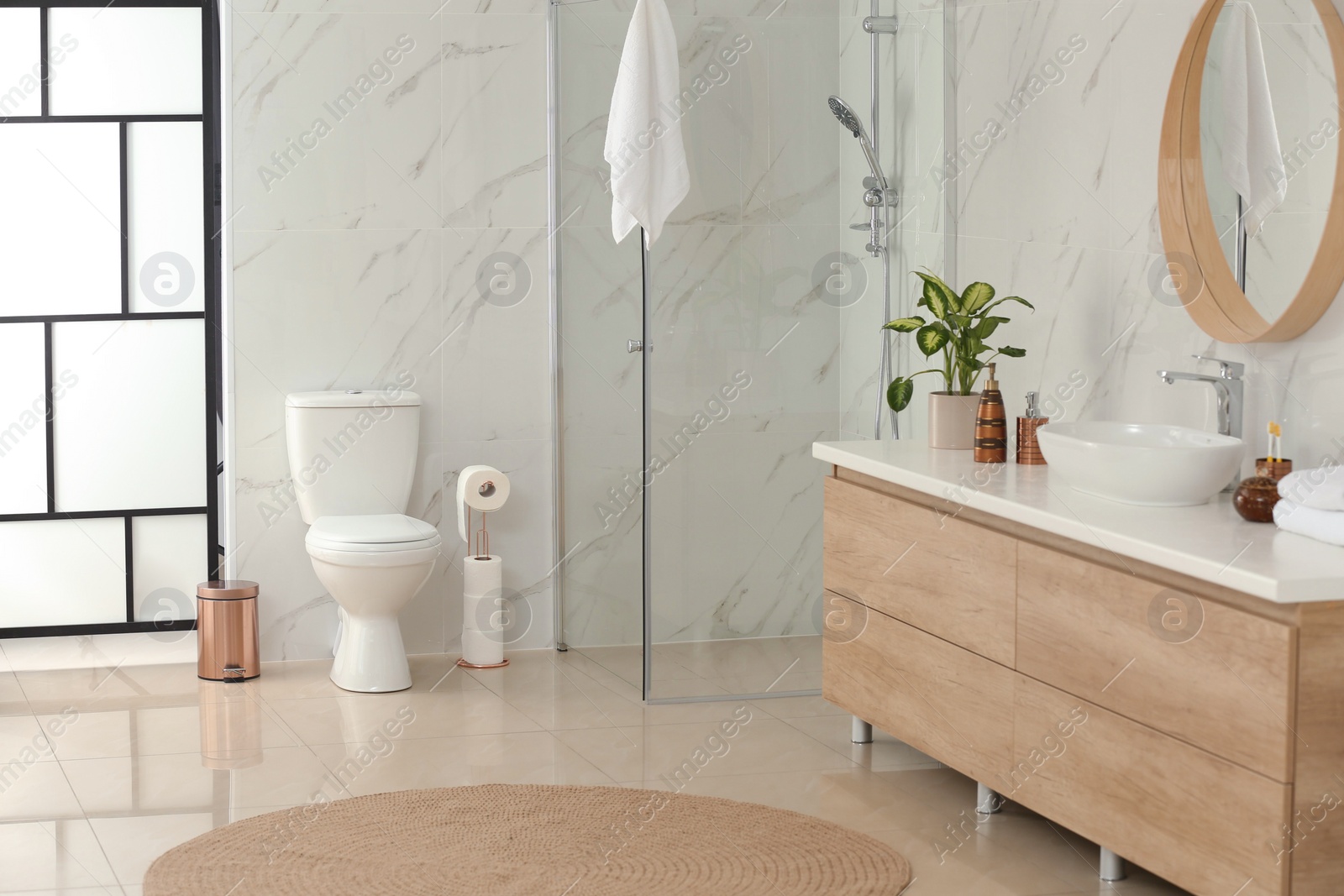 Photo of Interior of modern bathroom with toilet bowl