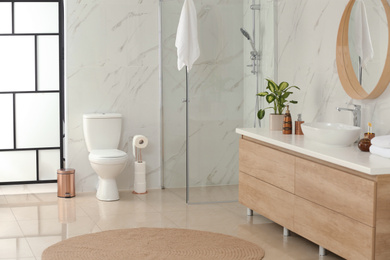 Photo of Interior of modern bathroom with toilet bowl