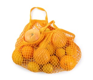 String bag with oranges and lemons isolated on white, top view