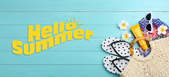 Hello Summer. Flat lay composition with beach accessories on light blue wooden background, banner design 