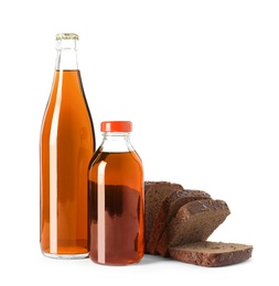 Bottles of delicious fresh kvass and bread isolated on white