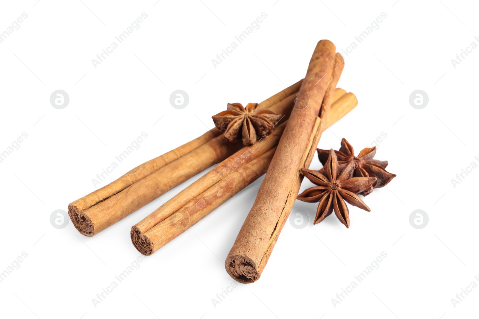 Photo of Cinnamon sticks and anise stars isolated on white