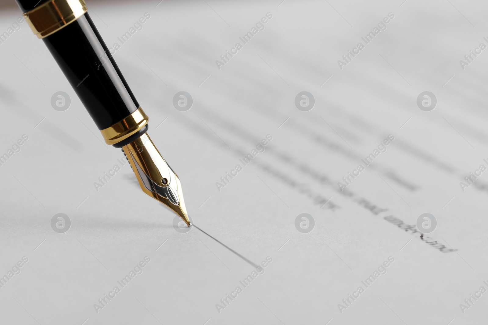 Photo of Writing on document with fountain pen, closeup. Notary contract